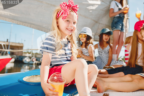 Image of The children on board of sea yacht