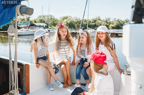 Image of The children on board of sea yacht