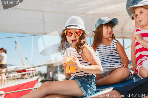 Image of The children on board of sea yacht