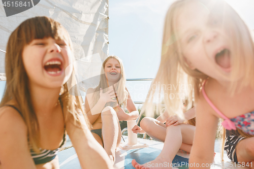 Image of The children on board of sea yacht