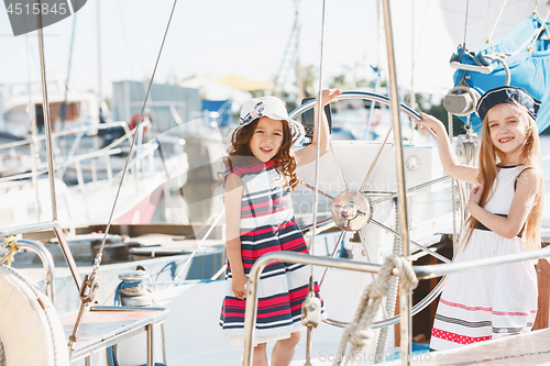 Image of The children on board of sea yacht