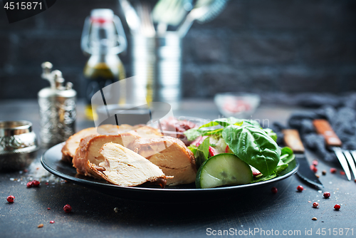 Image of meat with salad