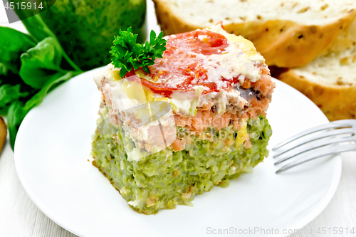 Image of Casserole of salmon and rice on white board