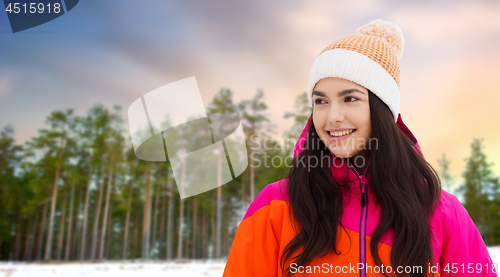 Image of happy teenage girl in winter clothes outdoors