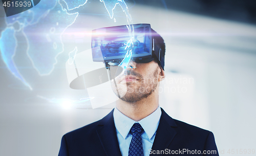 Image of businessman with virtual reality headset at office