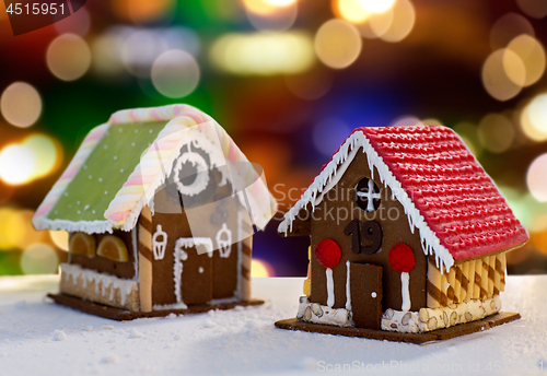Image of gingerbread houses over christmas lights