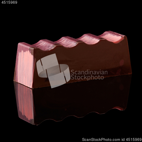 Image of chocolate candy on black background