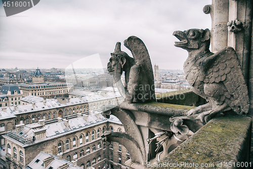 Image of gargoyle sits on top of Notre Dame