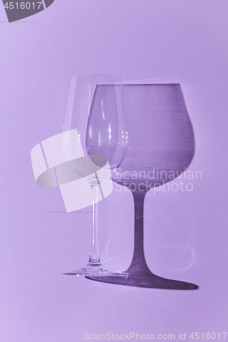 Image of Wineglass isolated on purple background