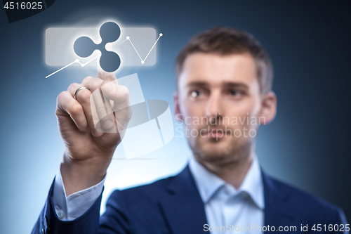 Image of business man touches a ripple icon