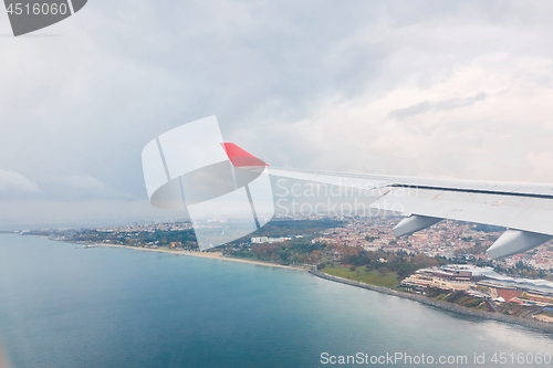 Image of view from the airplane window to the city