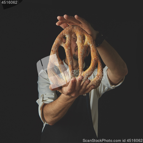 Image of Baker holding fougas bread