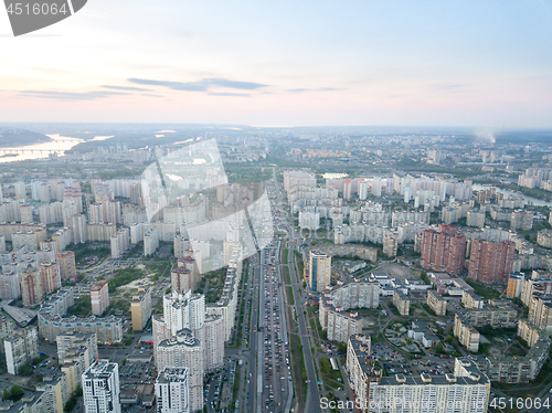 Image of A bird\'s eye view, aerial panoramic view from drone to the Darnyts\'kyi district of Kiev, Ukraine and view to the right bank of Dnieper at sunset in the summer.