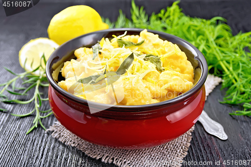 Image of Gnocchi pumpkin with sage in bowl on dark board