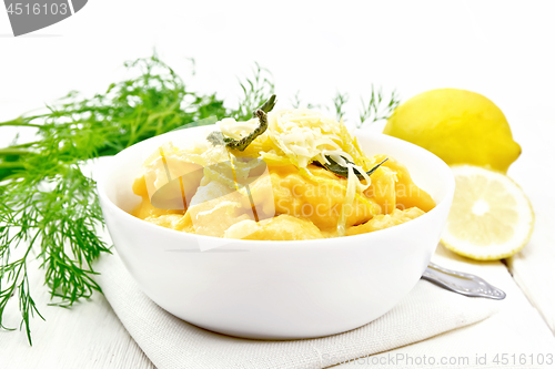 Image of Gnocchi pumpkin with lemon in bowl on board