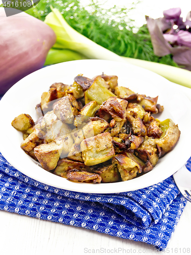 Image of Eggplant fried on white wooden board