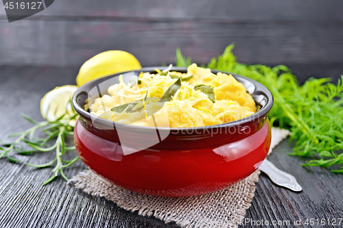 Image of Gnocchi pumpkin with lemon in bowl on wooden table