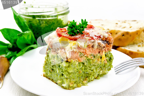 Image of Casserole of salmon and rice on light board