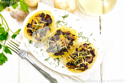 Image of Potatoes stuffed with mushrooms on board top