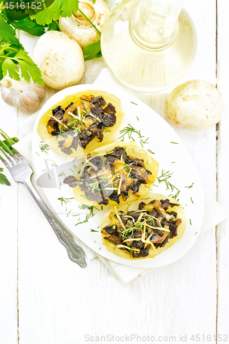 Image of Potatoes stuffed with mushrooms on light board top