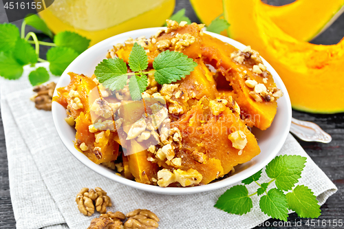 Image of Pumpkin with nuts and honey on board