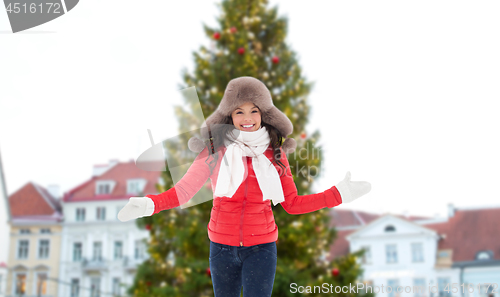 Image of happy woman over christmas tree in tallinn