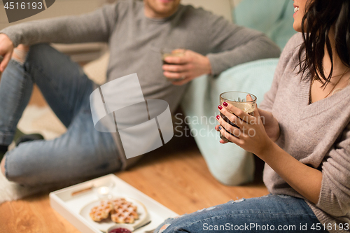 Image of close up of couple drinking coffee at home
