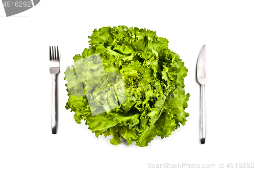 Image of Organic green salad, fork and knife on white background. 