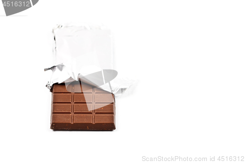 Image of Chocolate bar in foil isolated on white background.