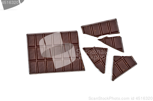 Image of Broken dark chocolate bar isolated on white.