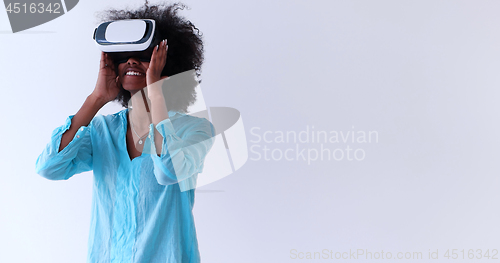 Image of black girl using VR headset glasses of virtual reality