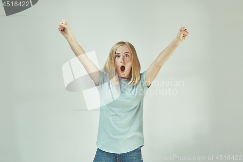 Image of Winning success woman happy ecstatic celebrating being a winner. Dynamic energetic image of female model