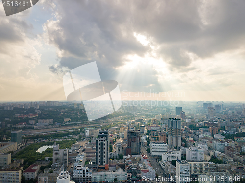 Image of Panoramic view to a central part of Kiev, Ukraine with modern buildings on a cloudy sunset background in the summer. Aerial view from drone.