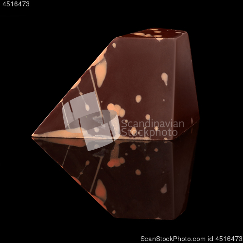 Image of chocolate candy on black background