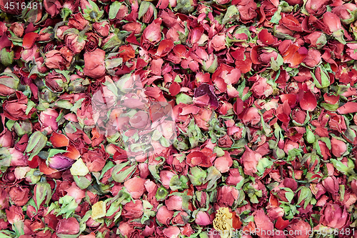 Image of tea with dry rose petals Background