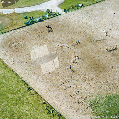 Image of Aerial view part of the racecourse in Kiev with a horse and people. Photo from the drone
