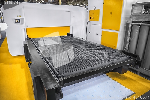 Image of Machine cutting steel with laser in a factory closeup