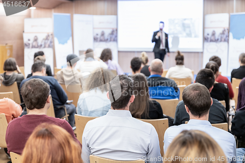 Image of Business speaker giving a talk at business conference event.