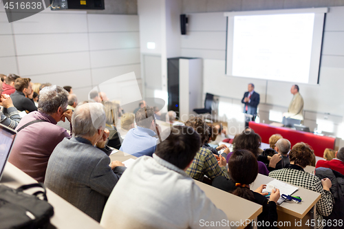 Image of Business speaker giving a talk at business conference event.