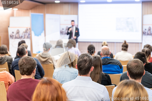 Image of Business speaker giving a talk at business conference event.