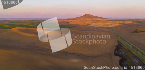 Image of Pink Light Bathes Clouds Behind Steptoe Butte Palouse Region Sun