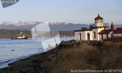 Image of Vessel Passing West Point Lighthouse Puget Sound Seattle Washing