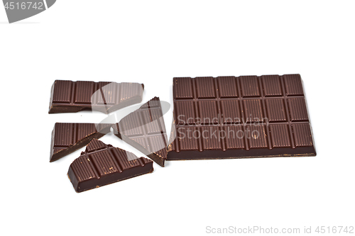 Image of Broken dark chocolate bar isolated on white.