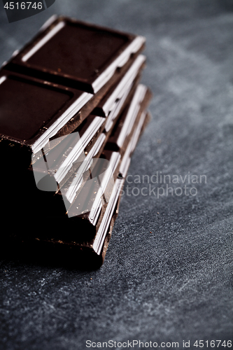 Image of Dark chocolate bar pieces closeup. Sweet food photo concept. 