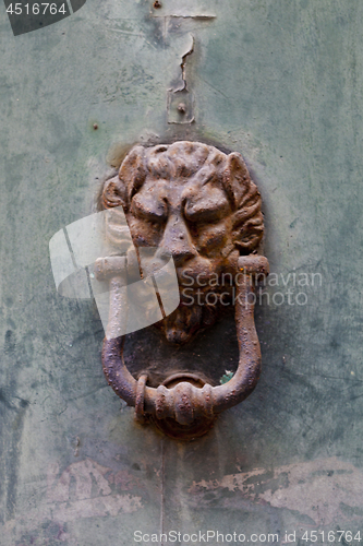 Image of Ancient italian lion shaped door knocker.