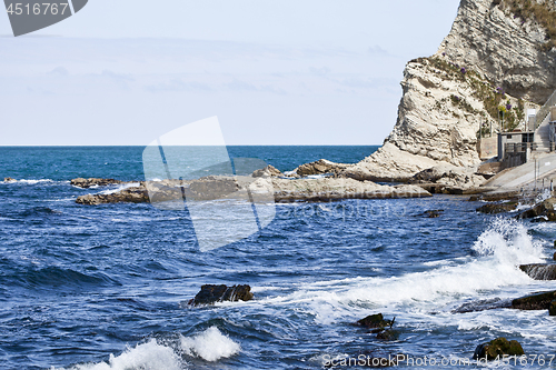 Image of Blue sea water, stones and rocks on Adriatic sea coast.