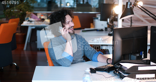 Image of businessman working using a computer in startup office