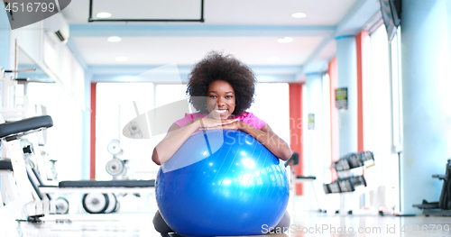 Image of portrait of young afro american woman in gym on workout break