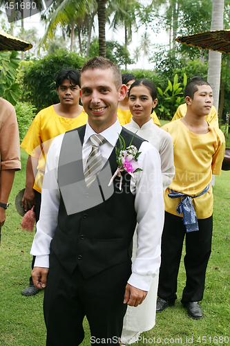 Image of SAMUI - AUGUST 1: Groom surrounded by traditional Thai dancers p