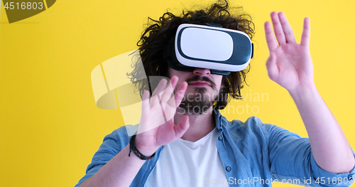 Image of happy man using VR headset glasses of virtual reality